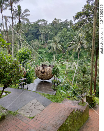 Wicker basket as a swing at Ceking Rice Terrace or Tegalalang Rice Terrace, Ubud, Bali at Indonesia Wicker basket as a swing at Ceking Rice Terrace or Tegalalang Rice Terrace, Ubud, Bali at Indonesia 124100936