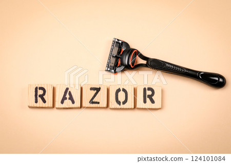 RAZOR Text made from wooden alphabet letters on a light background 124101084