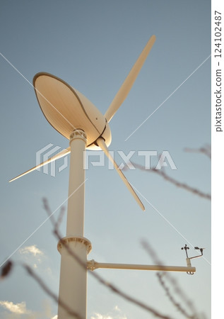 Windmill shines in the blue sky Windmill shines in the blue sky 124102487