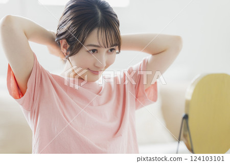 Women in pajamas doing skin care 124103101