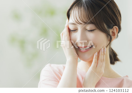 Women in pajamas doing skin care Women in pajamas doing skin care 124103112