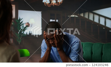 Nurse experiences emotional stress sitting in counseling session, professional deals with mental health issues because of the risks of his occupation. Trauma from patient loss. Camera A. Nurse experiences emotional stress sitting in counseling session, professional deals with mental health issues because of the risks of his occupation. Trauma from patient loss. Camera A. 124103246