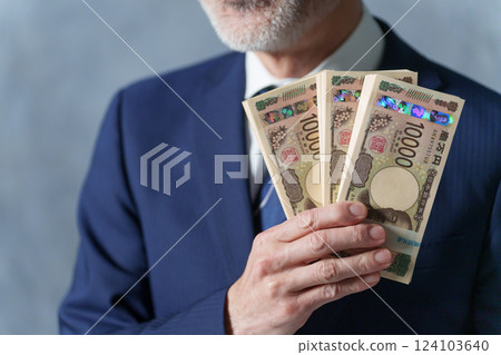 Businessman with a bundle 124103640