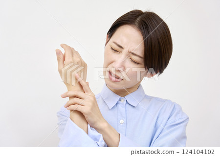 Woman with numb hands, white background 124104102