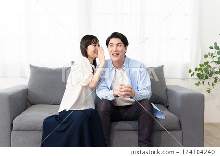 A couple talking secretly A couple talking secretly 124104240