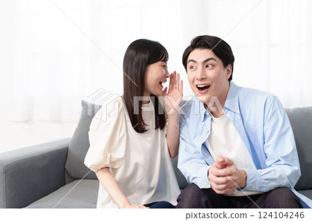 A couple talking secretly A couple talking secretly 124104246