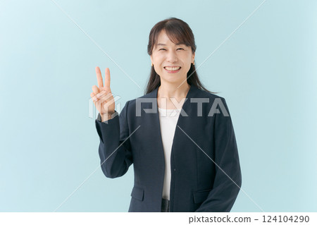 Businesswoman happy with peace sign 124104290