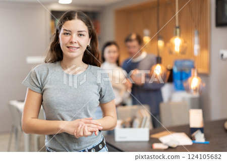 Female manager invites you to buy furniture Female manager invites you to buy furniture 124105682