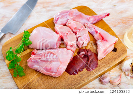 Raw rabbit meat with natural ingredients before cooking Raw rabbit meat with natural ingredients before cooking 124105853