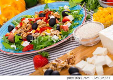 Ingredients and ready-made salad with rocket 124105855