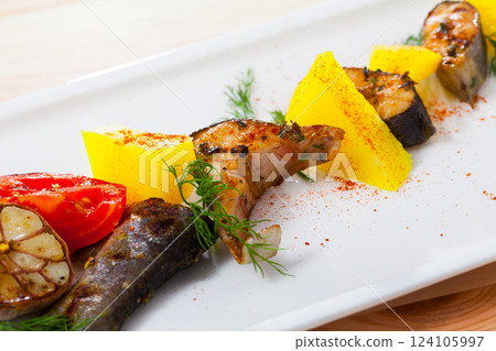 Appetizing baked trout steaks 124105997