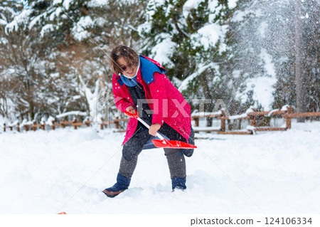 Couple playing in the snow 124106334