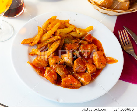 Stewed pork in sauce served on platter Stewed pork in sauce served on platter 124106690