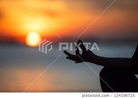 Close up hands Silhouette lifestyle woman yoga exercise for healthy life.  People pose balance body vital zen and meditation workout and fitness sport  124106728