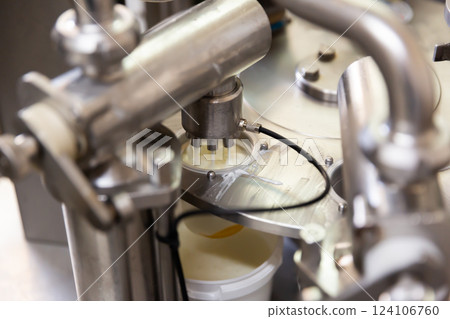 Mechanized milking equipment working in cow farm 124106760