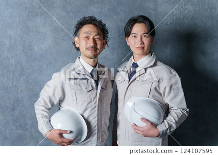 Two businessmen (construction workers) wearing work clothes Two businessmen (construction workers) wearing work clothes 124107595