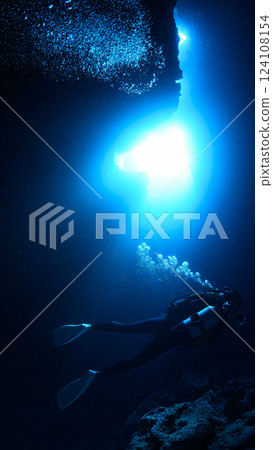 Diver looking up at the light from underwater, Miyakojima, Cross Hole Diver looking up at the light from underwater, Miyakojima, Cross Hole 124108154