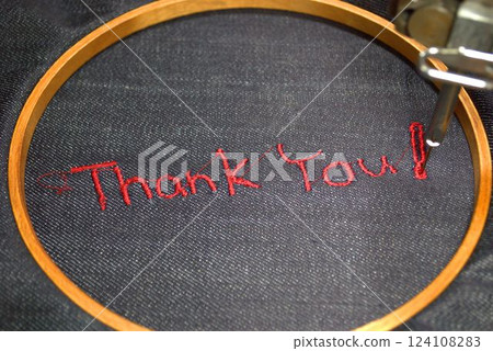Thank you embroidered on denim fabric Thank you embroidered on denim fabric 124108283