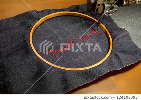Thank you embroidered on denim fabric Thank you embroidered on denim fabric 124108398