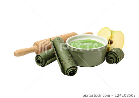 PNG, Three green rolls of fruit pastille, bowl with mashed fruit and piece of apple, isolated on white background PNG, Three green rolls of fruit pastille, bowl with mashed fruit and piece of apple, isolated on white background 124108502