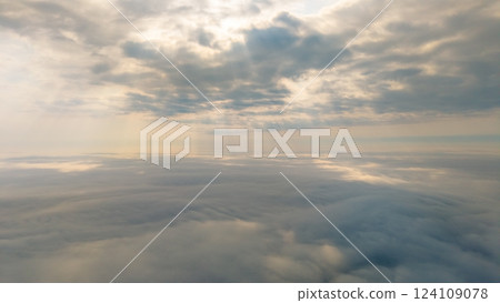 Serene Sky With Gentle Clouds and Sunlight Rays 124109078