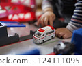 Kids playing with cars 124111095