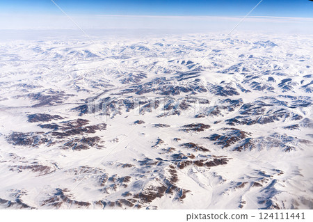The snow-capped Tangla Mountains of the Tibetan Plateau in China, a high-altitude view from an airplane 124111441