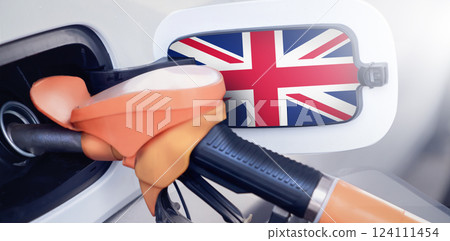 The flag of great Britain on the hatch of the gas tank of a car at a gas station. Gasoline and diesel fuel in britain. High prices for diesel fuel, gasoline and gas at gas stations in British The flag of great Britain on the hatch of the gas tank of a car at a gas station. Gasoline and diesel fuel in britain. High prices for diesel fuel, gasoline and gas at gas stations in British 124111454