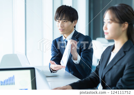 Young businessman to discuss 124111752