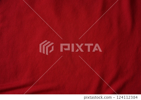 Close up of red football jersey sports clothing fabric texture. 124112384