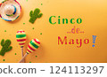 Cinco de Mayo holiday background made from maracas, cactus and hat on yellow background. 124113297