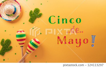 Cinco de Mayo holiday background made from maracas, cactus and hat on yellow background. 124113297