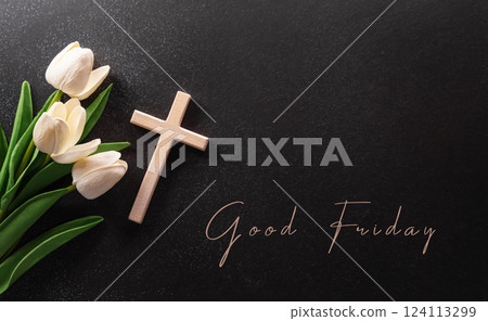 Good Friday and Holy week concept - A religious cross and flower on dark stone background. 124113299