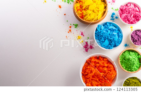 Happy Holi decoration, the indian festival.Top view of colorful holi powder on white background. Happy Holi decoration, the indian festival.Top view of colorful holi powder on white background. 124113305
