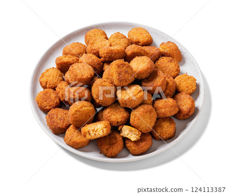crunchy breaded salmon fish nuggets on plate 124113387