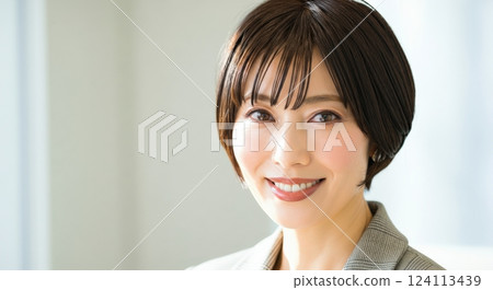 Confident asian female professional smiling in corporate setting for business communication 124113439