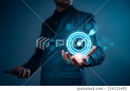 Businessman with target arrow virtual digital technology icon, business investment objectives and goals Marketing strategies and goals for success. 124113485