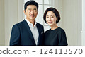 Elegant asian couple in formal attire posing indoors for professional portrait 124113570