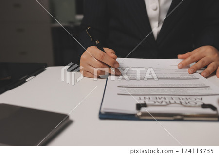 Judge gavel with Justice lawyers having team meeting at law firm background. Concepts of Law and Legal services. 124113735