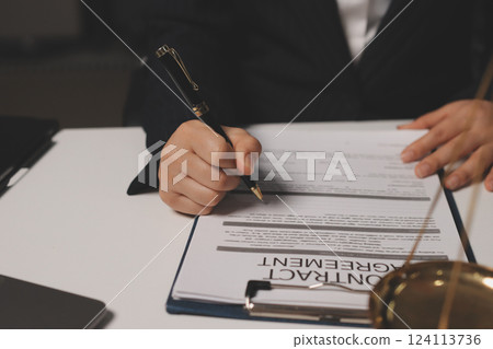 Judge gavel with Justice lawyers having team meeting at law firm background. Concepts of Law and Legal services. Judge gavel with Justice lawyers having team meeting at law firm background. Concepts of Law and Legal services. 124113736