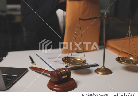 Judge gavel with Justice lawyers having team meeting at law firm background. Concepts of Law and Legal services. 124113738