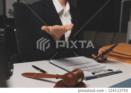 Judge gavel with Justice lawyers having team meeting at law firm background. Concepts of Law and Legal services. Judge gavel with Justice lawyers having team meeting at law firm background. Concepts of Law and Legal services. 124113750
