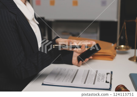 Judge gavel with Justice lawyers having team meeting at law firm background. Concepts of Law and Legal services. Judge gavel with Justice lawyers having team meeting at law firm background. Concepts of Law and Legal services. 124113751