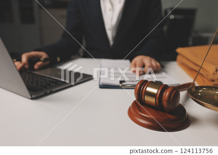 Judge gavel with Justice lawyers having team meeting at law firm background. Concepts of Law and Legal services. Judge gavel with Justice lawyers having team meeting at law firm background. Concepts of Law and Legal services. 124113756
