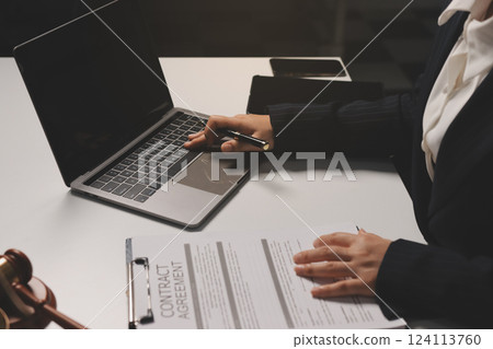 Judge gavel with Justice lawyers having team meeting at law firm background. Concepts of Law and Legal services. Judge gavel with Justice lawyers having team meeting at law firm background. Concepts of Law and Legal services. 124113760