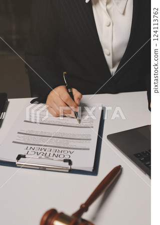 Judge gavel with Justice lawyers having team meeting at law firm background. Concepts of Law and Legal services. Judge gavel with Justice lawyers having team meeting at law firm background. Concepts of Law and Legal services. 124113762