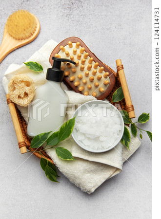 Magnesium flakes and eco friendly accessories creating relaxing spa setting Magnesium flakes and eco friendly accessories creating relaxing spa setting 124114731