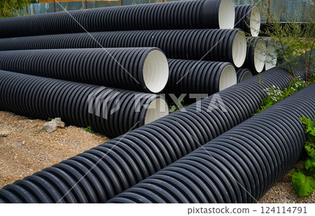 Stack of PVC U canalization pipes plumbing tube on a hardware store stock. Stack of PVC U canalization pipes plumbing tube on a hardware store stock. 124114791