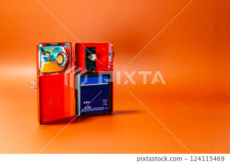 Open antique lantern on an orange background Open antique lantern on an orange background 124115469