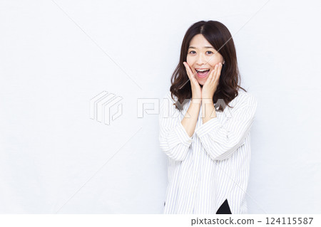 A woman surprised with a smile 124115587